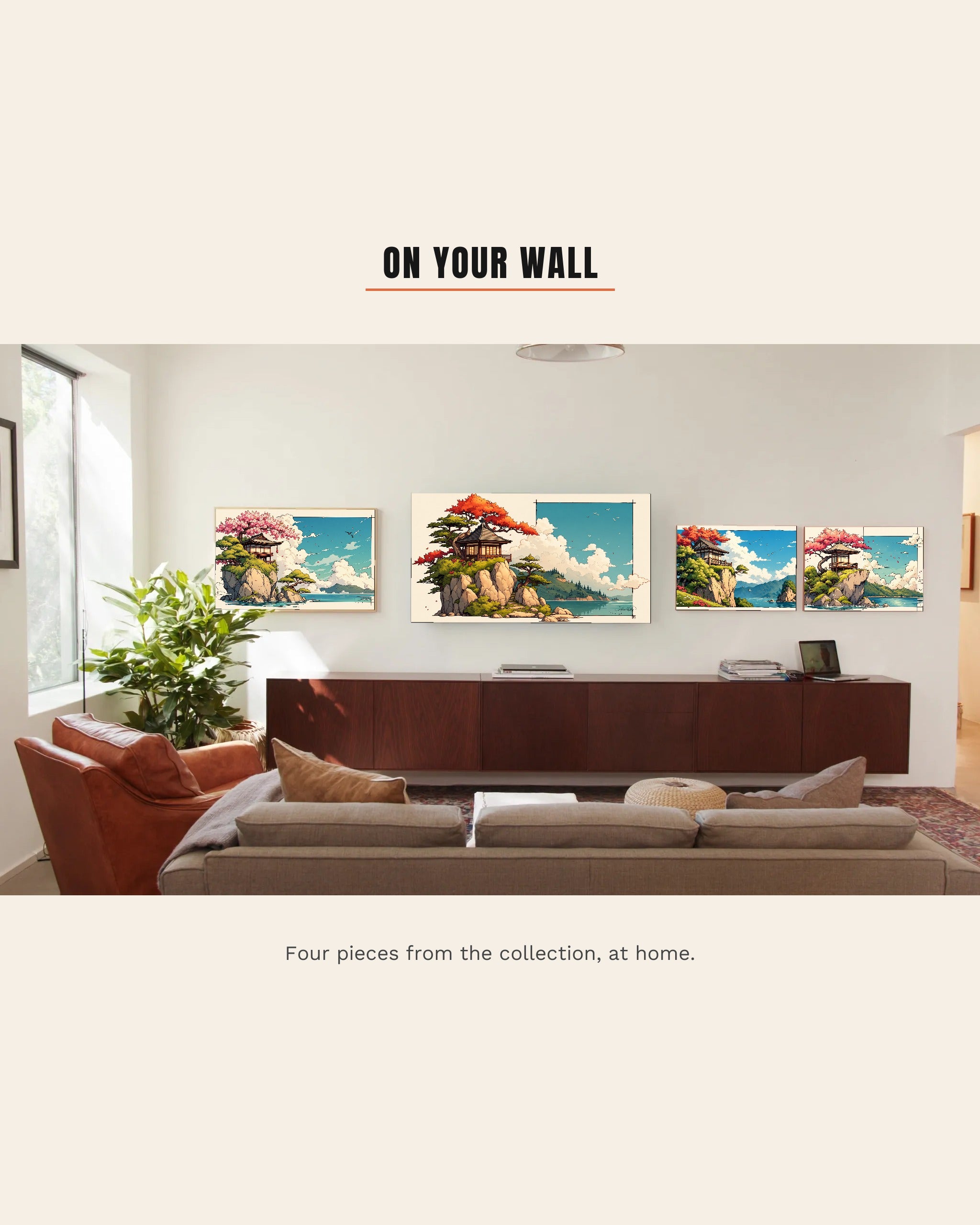 A bright living room with four Same Ocean pieces on the wall, a red maple house on a clifftop on the large screen with three coastal pieces framed beside it