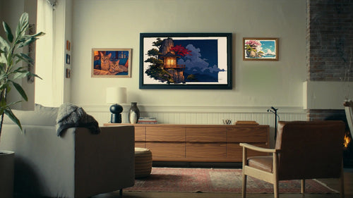 A Same Ocean night piece shown on the television in a warm evening living room, with Ghost and Junior framed on the left and a Same Ocean daytime piece on the right